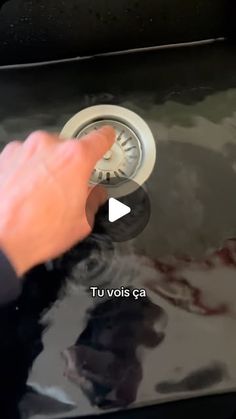 a person is turning on the faucet to check out their car's condition