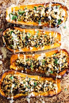 four stuffed sweet potatoes on a baking sheet