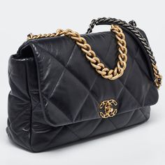 CHANEL Black Quilted Leather Maxi 19 Shoulder BagFirst unveiled in the Chanel Fall 2019 collection, the Chanel 19 bag is named after the year of its release, just like the Chanel 2.55. In design, the bag has exaggerated quilting and hardware in two tones. This version in black is made from leather and lined with fabric. It has a CC twist lock, a small chain handle to be carried by hand, and a longer chain for shoulder/crossbody wear. Size: Height: 25 cm, Width: 11 cm, Length: 36 cmMaterial: LeatherThis item has been used and may have some minor flaws. Before purchasing, please refer to the images for the exact condition of the item. Chanel Fall 2019, Chanel 19 Bag, Bag Chanel, Versace Bags, Chanel 2, Prada Crossbody Bag, Black Quilt, Chanel Black