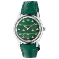 From Gucci, the G-Timeless collection continues to explore emblematic House codes in new ways each season. This automatic watch is designed with a green malachite stone dial, paired with a green alligator leather strap. The emblematic bee motif enriches the style. 38mm steel case Green malachite stone dial with bees Green leather strap Sapphire glass with antireflective coating 5 ATM (164 feet/50 meters) Power reserve: 38 hours Automatic movement Wrist size from 150mm to 190mm Gucci Style #: YA1 Diamonds Direct, Timeless Watches, European Jewelry, Gucci Style, Gucci Watch, Leather Strap Watch, Green Malachite, Malachite Stone, Gucci Fashion