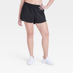 Why we're ALL IN: Mid-rise shorts designed in a solid hue to take you through anything from training sessions and walks to intense runs in effortless comfort. Tailored in regular-fit, these mid-rise shorts are designed from a moisture-wicking fabric with a quick-dry finish to help keep you cool and dry. A full elastic waistband provides a secure fit, while a side zippered pocket finishes off the sporty look. All in Motion™: Made for every move, priced for every day. Rise And Run, Workout Shorts Women, Black Biker Shorts, Running Shorts Women, Red Fits, Mid Rise Shorts, Recycled Polyester Fabric, All In Motion, Woman Weaving