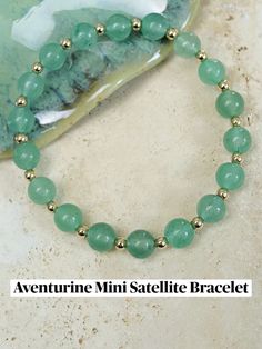 Green Aventurine is cherished for attracting luck, growth, and prosperity. Known as the "Stone of Opportunity," it encourages abundance and success, promoting emotional healing, harmony, and balance through the Heart Chakra. Its soothing energy inspires optimism, creativity, and decisiveness, fostering inner strength and confidence for new opportunities and adventures.



Our beaded bracelets are made with high quality stretch nylon thread. Any gold components are gold-fill, which is basically a much larger plating of gold beyond the normal thickness of standard plating, which ensures your jewelry will be lasting much longer than traditional plated jewelry. Inner Strength, New Opportunities, Emotional Healing, Green Aventurine, Heart Chakra, Jewelry Plate, Chakra, Gold Filled, The Fosters