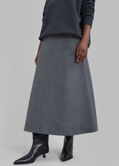 Color: Grey Midweight wool blend fabric Midi length A-line silhouette Front pockets Concealed partial side zip closure Partially lined 45% Wool 38% Polyester 17% Rayon Dry Clean By The Frankie Shop. Imported Grey Maxi Skirt, Grey Maxi Skirts, The Frankie Shop, Frankie Shop, Gray Skirt, Long Skirt, Midi Length, Side Zip, Wool Blend