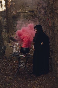 Pregnant Witch Photoshoot, Maternity Halloween Photography, Cauldron Gender Reveal How To, Gender Reveal Ideas For Halloween, Gender Reveal Cauldron, Halloween Maturity Shoot, Gender Reveal Spooky, Emo Maternity Outfits, Witch Maternity Shoot