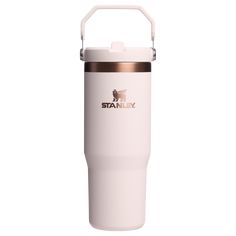 thermos travel tumbler is white and has a metal handle on one side