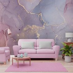 a living room with pink furniture and a large painting on the wall