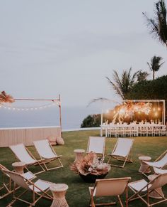 chairs and tables are set up on the lawn