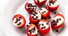 some strawberries with chocolate chips on top of them