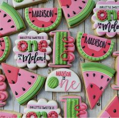 decorated watermelon cookies are displayed on a table