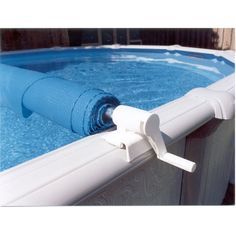 an inflatable swimming pool is shown with the cover pulled up to protect it from falling