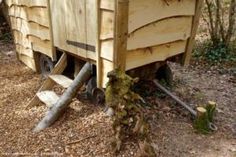 an old wooden box sitting in the woods