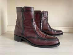 To view the full description for this vintage item, please expand the listing ♥️ Authentic vintage '70s oxblood leather boots! Gorgeous vintage footwear. Genuine leather uppers, quarter lining and sole.  Look nearly new with a teeny bit of wear down to heel cap- tons of lift left, barely noticeable. interiors are clean, scuffing on soke expected from light wear. Zippers work fine. Made in India, marked size 7D. (Men's) I wear a women's 7.5-8M and these feel a size too big in my foot. I think they are the equivalent of a women's 8 but please check measurements. (D with in men's shoes is a medium width) Toe to heel at sole: 11" Tie to heel inside the boot: approx 10.5" Width of sole at ball of foot: 3 5/8" ♥️ Thank you for visiting! All sales on vintage are final, no returns or order cancell 70s Boots, 70s Shoes, Boots Fit, Womens Booties, Oxblood Leather, Booties Ankle Boots, Heel Caps, Boot Shoes Women, Leather Boots