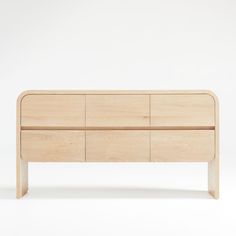 the sideboard is made out of wood and has four drawers on one end, and two