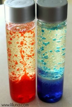 two bottles with different colored liquids in them