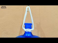 a blue glass bottle hanging from a rope