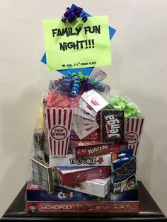 a pile of candy sitting on top of a wooden table next to a sign that says family fun night