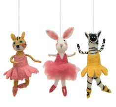 three stuffed animals hanging from strings in the shape of rabbits, zebras and giraffes