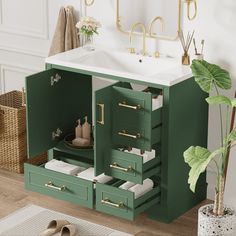 a bathroom vanity with drawers and a sink in the center, next to a plant