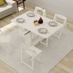 a white table and chairs in a room