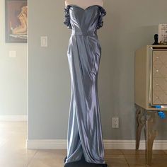 Such A Gorgeous And Flattering Dress Worn Once, Has A Little Stretched Out Part Next To Zipper But It Won’t Show As It Falls Behind The Belt. Can Be Worn On Or Off Shoulder Has A Subtle Train Gray Prom Dress With Fitted Bodice, Dusty Blue Fitted Elegant Dress, Elegant Fitted Dusty Blue Dress, Fitted Gray Dresses With Sweep Train, Fitted Gray Dress With Sweep Train, Gray Fitted Dress With Sweep Train, Fitted Gray Evening Dress With Sweep Train, Fitted Gray Evening Dress, Fitted Gray Prom Gown