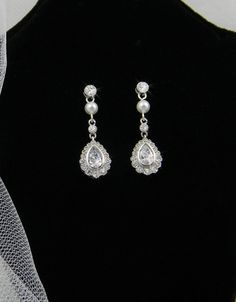 . Classic Elegant Crystal Earrings For Wedding, Wedding Sterling Silver Crystal Earrings With Pearl Drop, Sterling Silver Crystal Pearl Drop Earrings For Wedding, Classic Silver Chandelier Earrings For Wedding, Classic Crystal Earrings For Wedding With Elegant Design, Formal Bridal Accessories With Matching Drop Earrings, Elegant Silver Wedding Earrings, Elegant Silver Drop Earrings Bridal Accessories, Silver Wedding Earrings With Elegant Design