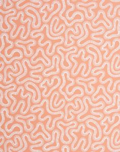 an orange and white wallpaper pattern with wavy lines on it's surface,