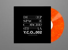 an orange and black vinyl record with the words deep space orches stra y c o 002 on it