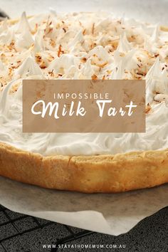 a pie with whipped cream and nuts on top