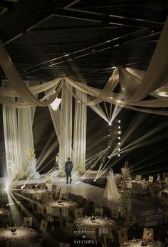 a man standing in front of a stage set up for a wedding