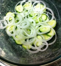 sliced cucumbers and onions in a bowl