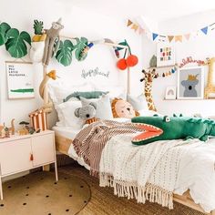 a child's bedroom decorated in white, green and orange with stuffed animals on the bed