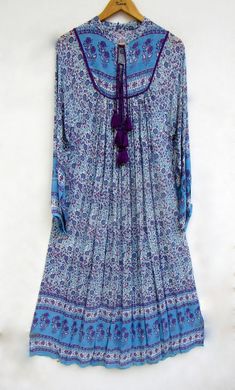 "ITEM DESCRIPTION traditional hippie look long maxi dress - collared neckline with tassel maxi dress - long sleeve boho maxi dress Features: Long sleeve, collared neck, Long dress Material: rayon crepe Fabric: 100% rayon soft light weight ethnic print fabrics  Sleeve Length = 22 inch For more sizes & their measurement, please refer our below chart to understand the sizes variations available with us For your size requirement, please mention your size in seller note at the time of buying. SIZE MEASUREMENT  BUSTLENGTHSHOULDER XXS34 inch51 inch13.5 inch XS36 inch51 inch14 inch S38 inch51 inch14.5 inch M40 inch51 inch15 inch L42 inch51 inch16 inch XL44 inch51 inch16.5 inch 2XL46 inch51 inch17 inch 3XL48 inch51 inch18 inch   Company Return Policy:  Please write for more information to my email Purple Boho Dress, Long Sleeve Boho Maxi Dress, Maxi Dress Long Sleeve, Hippie Look, Ethnic Print, Maxi Robes, Long Summer Dresses, Boho Maxi, Boho Maxi Dress