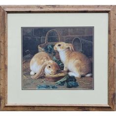 two rabbits sitting next to each other in front of a basket