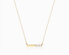 14K Yellow Gold Bar Diamond Necklace. This minimal gold and diamond bar necklace is the perfect gift for those looking for an elegant, modern look. The polished gold is offset with three dazzling diamonds delivering the perfect amount of sparkle on an 18 inch chain. aka Diamond Necklaces Minimalist Diamond Bar Necklace With Single Cut Diamonds, Minimalist Bar Necklace With Single Cut Diamonds, Minimalist Diamond Accents Bar Necklace As Gift, Minimalist Diamond Accents Bar Necklace Gift, Minimalist Bar Necklace With Diamond Accents For Gift, Minimalist Bar Necklace With Diamond Accents, Minimalist Bar Necklace With Diamond Accents As Gift, Gold Minimalist Diamond Bar Necklace, Minimalist Gold Diamond Bar Necklace