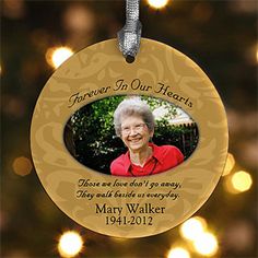 a memorial ornament hanging from a christmas tree