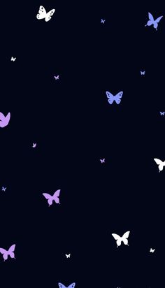 purple and white butterflies flying in the night sky