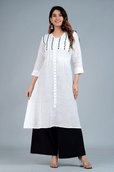 The very beautiful hand embroidered Linen-cotton tunic or kurta, available on demand (made to order) and customizable.Sizing: Please refer to our Size Chart to find your sizeThe item features55% Linen 45% CottonV Neck with front decorative buttonsLong tunic for culottes, leggings or pants3/4 sleevesAverage length: 45 in; Length customizableLength of product may slightly vary as per the sizes. Please note: smaller size may be slightly shorter and bigger size may be slightly longer in lengthVarious colors availableMachine washable (Use mesh, Delicate cycle, Hang Dry)Delivery time: 4-6 weeksFor customization, please email us at info@ayurvastram.comYou can ask for shorter or longer lengths as per your convenience, or for a new color as well. Most customizations are accommodated. White Linen Kurta With Resham Embroidery, Festive White Kurta With Embroidered Neckline, White Linen Straight Kurta, Traditional White Kurta With Embroidered Hem, White Handloom Cotton Kurta, White Cotton Kurta With Embroidered Neckline, White Embroidered Kurta For Spring, White Kurta With Embroidered Neckline For Spring, White Embroidered Neckline Kurta For Spring