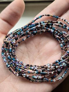 This listing is for a set of ten seed bead boho beaded bracelets. These  blue, black, gunmetal and brown multi color confetti bracelets have dainty, tiny beads and chunky round beads are strung on strong elastic. They are double knotted and glued shut. These stretchy, stackable bracelets would be cute friendship bracelets or gifts for best friends, gifts for her. Black Heishi Beads Bohemian Bracelet, Bohemian Black Heishi Beads Bracelets, Black Bohemian Heishi Beaded Bracelet, Bohemian Black Heishi Beads Bracelet, Multi-strand Beaded Bracelets With Spacer Beads For Festival, Festival Multi-strand Heishi Beads Bracelets, Multi-strand Tiny Beads Bracelet For Festival, Festival Multi-strand Beaded Bracelets With Tiny Beads, Festival Multi-strand Bracelets With Tiny Beads