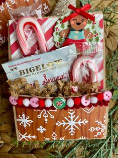 a christmas gift basket with candy canes, cookies and candies