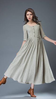 "★★ Welcome to my shop and thanks for your interested to the maxi gray dress.It is  a pale gray linen dress,round collar,half sleeve,has white cotton  lining, so it is not see through.It has a side zipper,has four buttons,has  two pockets in the waist.This dress is featured with casual,soft and  comfortable fabric and lining for your skin to breathe. Super feminine but oh-so-comfortable, this soft pale gray linen dress is a must-have for any woman's everyday wardrobe.  Wear it with a pure silk s Flare Long Dress, Sukienki Maksi, Tunic Designs, Long Linen Dress, Summer Linen Dresses, Dress For Summer, Most Beautiful Dresses, Maxi Robes, Linen Maxi Dress