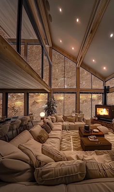 a living room filled with lots of furniture and windows