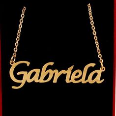 Gabriela Name Necklace 18ct Gold Plated Personalized Dainty Necklace About This Item Ideal Gift For Any Special Occasion. Adjustable Chain Ranging From 16-19 Inches In Length. The Thickness Of The Necklace Is 1mm Pendant Height Is 5-8mm And Width Is 30mm-70mm Depending On Number Of Letters. The Weight Of The Necklace Is Between 8g And 10g Depending On The Length Of The Name. Rr-507 32 Necklace, Tiffany And Co Necklace, Band Necklace, Flower Statement Necklace, Pearl Strands Necklace, Mask Necklace, Rhinestone Choker Necklace, Rhinestone Choker, Mother Of Pearl Necklace