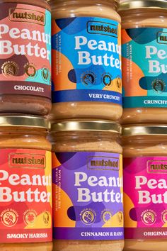 six jars of peanut butter are stacked on top of each other