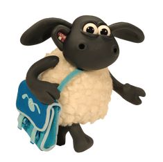 a black and white sheep carrying a blue bag