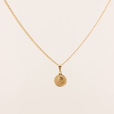 D E T A I L S • Single Coin Necklace• 18k Gold Filled• Chain Length: 18" with 1" extender• Small Coin Size: 12mm x 15mm• Medium Coin Size: 15mm x 18mm M A T E R I A L S •Our Gold filled jewelry has an outer layer of 14k or 18k gold that is pressure bonded to a base metal of jewelers brass. •This type of jewelry is made for everyday use of stacking or layering. • This type of jewelry can withstand normal body sweat, body oils, and is typically water resistant. J E W E L R Y C A R E Take extra car Classic Charm Necklaces With Coin Pendant, Classic Yellow Gold Charm Necklace With Coin Pendant, 14k Gold Coin Pendant Necklace For Everyday, Everyday 14k Gold Coin Necklace, Classic Gold-plated Coin Necklace With Round Pendant, Classic Gold Plated Coin Necklace With Round Pendant, Everyday Yellow Gold Coin Necklace, Classic Gold-plated Coin Necklace, Classic Gold Plated Coin Necklace