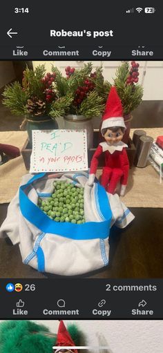 an elf is sitting in front of a bag of peas