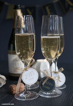 two glasses of champagne are sitting next to each other