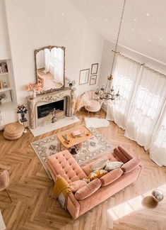 an aerial view of a living room with pink furniture