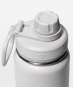 a white water bottle with a plastic cap on the lid and a loop at the top