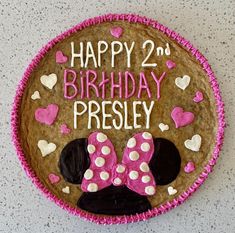 a birthday cake decorated to look like minnie mouse